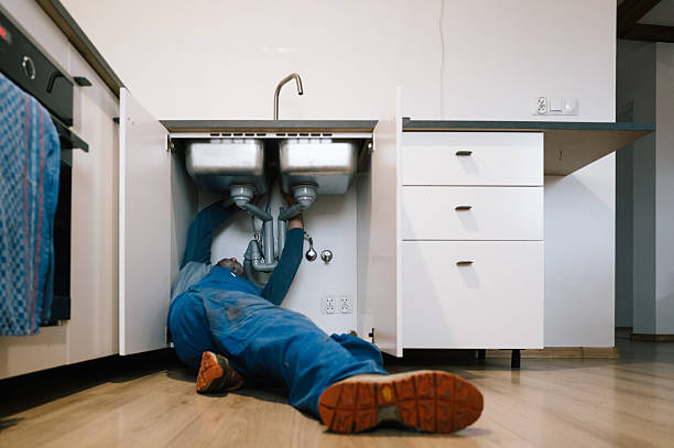 Professional Drain Cleaning technician working in Lansing, MI